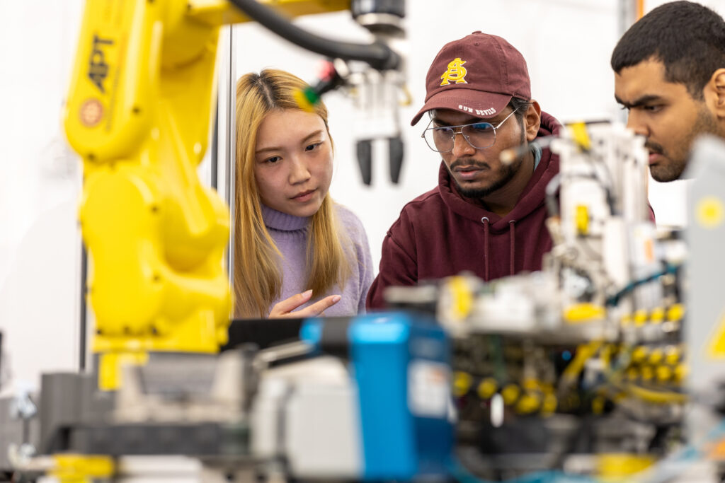 Arizona State University Polytechnic students in the Simulation Building engage in advanced robotics