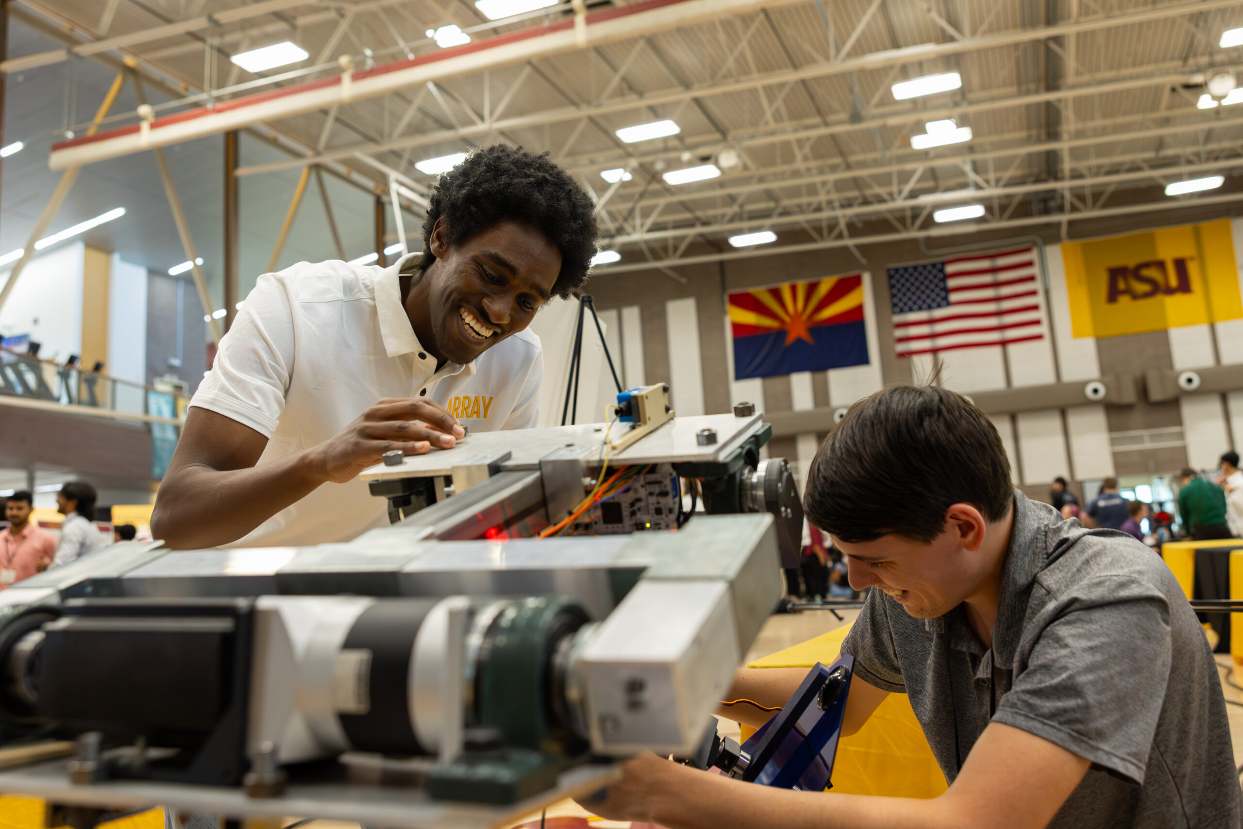 Two students working on a project at Innovation Showcase.